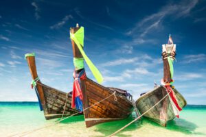 Thai traditional wooden boat at ocean shore Thailand